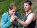 PH3th-collared_sub_gagged_with_socks.webp